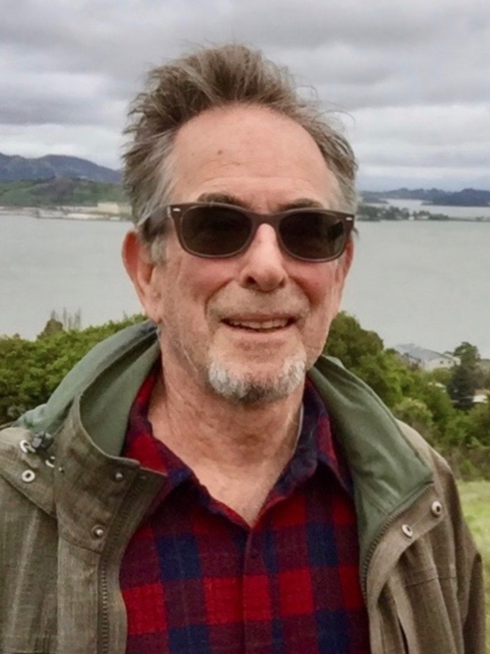 Daniel Ben-Horin outdoors by the water, wearing sunglasses